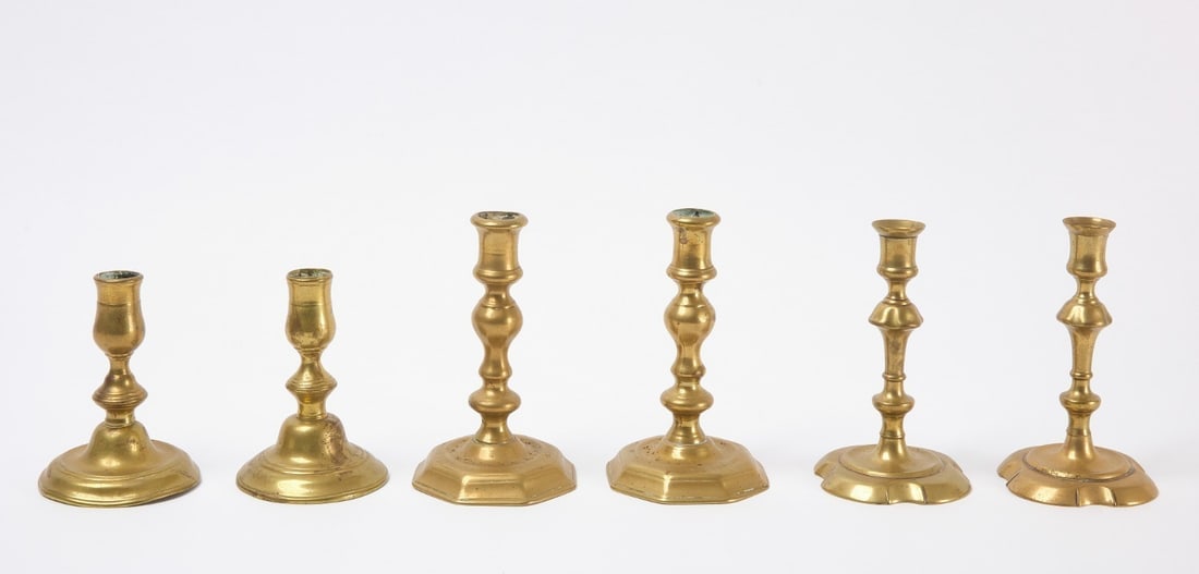Three Pairs of Brass Candlesticks: Three pairs of brass candlesticks. English, circa 1780-1810. Collection of Joel Einhorn. H 6-1/2 in. 6-3/4 in and 5-1/2 in.