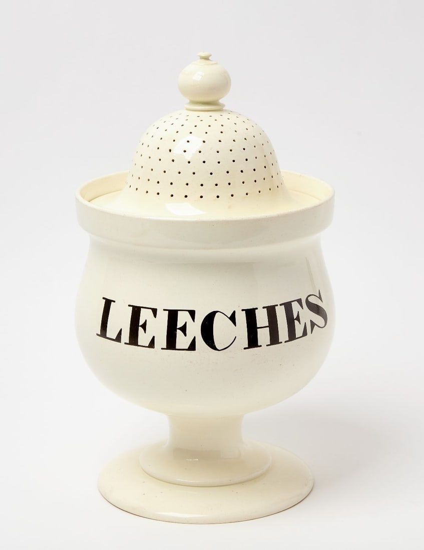 Pedestal Leeches Jar: Apothecary leeches jar in bulbous pedestal form. Earthenware with black lettering. Signed 'Spode' underneath base. English, 19th century. H 16 in. D 9 in. Provenance: Estate of Jerry Phelps (K