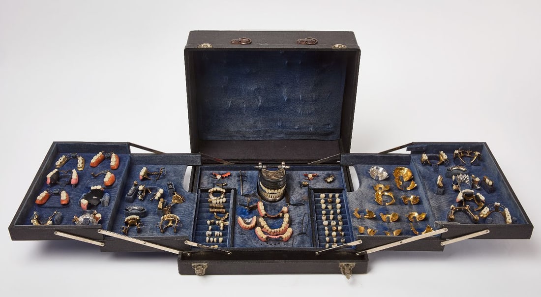 Wekabe Dental Prosthetic Kit: Wekabe dental prosthetic kit. Includes a variety of dental inserts and prosthetics in a folding case. Approximately 20.5 dwt in dental gold (acid tested 10k).English, circa 1900.Case: 4-1/2 in.
