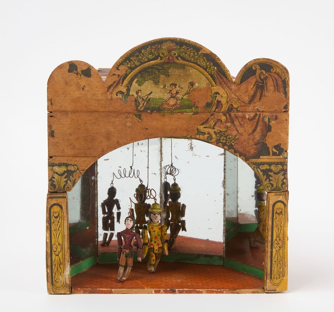 James M. Cromwell Automatic Dancers Clockwork Toy: James M. Cromwell 1865 patent Automatic Dancers clockwork toy. Chromolithograph paper over wood with mirrors, retaining original paper label. Two carved and painted wooden dancer figures hang from wir