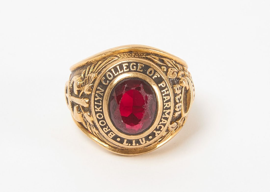 10k Brooklyn College of Pharmacy 1936 Class Ring: 10k gold (stamped) Brooklyn College of Pharmacy class ring from 1936. Band depicts caduceus as well as a mortar and pestle. Likely central garnet. Size 10.12 dwt.