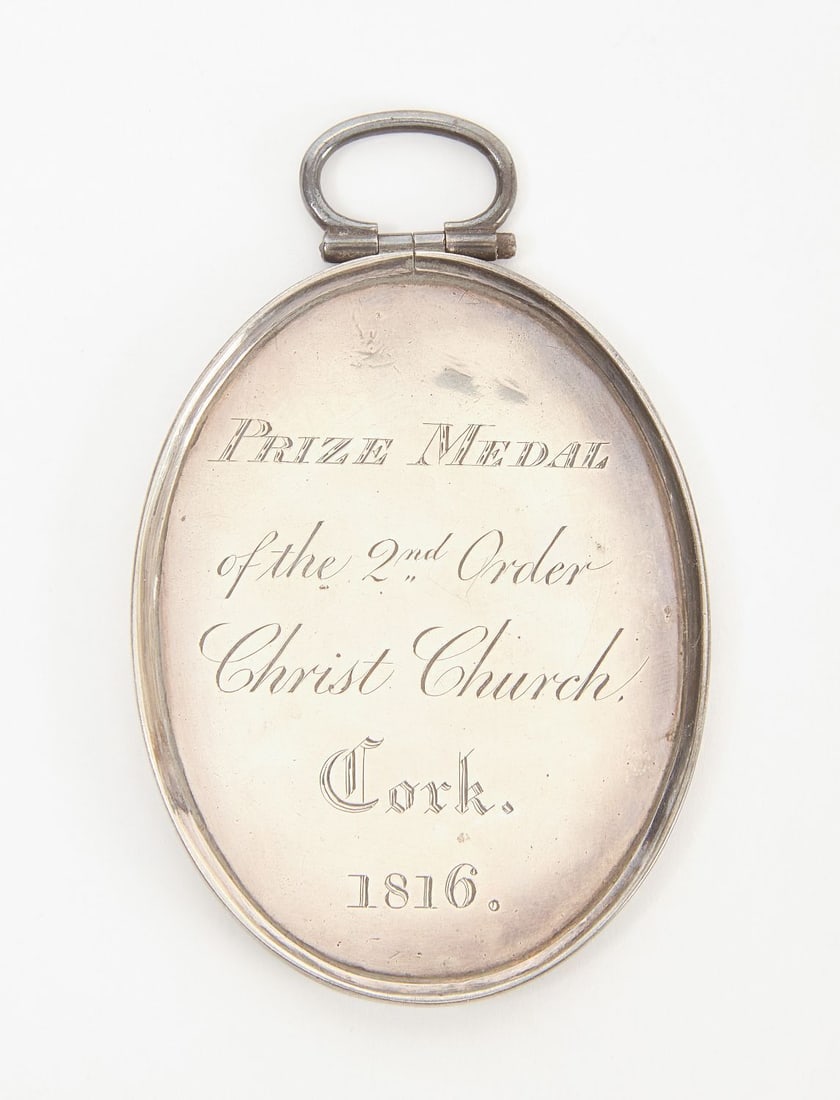 Early Irish Academic Prize Medal: Early academic prize medal of the 2nd order, Christ Chruch, Cork. Dated 1816. Adjudged to Gibbs Ross. One of the four best answers of 1103. Hinging bail. Irish, relating to Cork, Ireland. H 2-3/4 in.