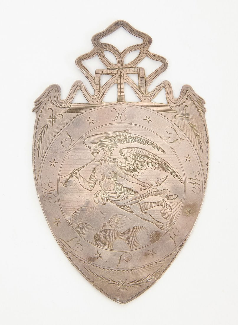 Early Masonic Medallion with Angel Gabriel: Early Masonic medallion with angel Gabriel. Pierced ribbon-form crest. New York, circa 1795. Very similar to the one shown in the Catalog of Freemasons Hall in London (see photo). L 2-5/8 in. W 1-5/8