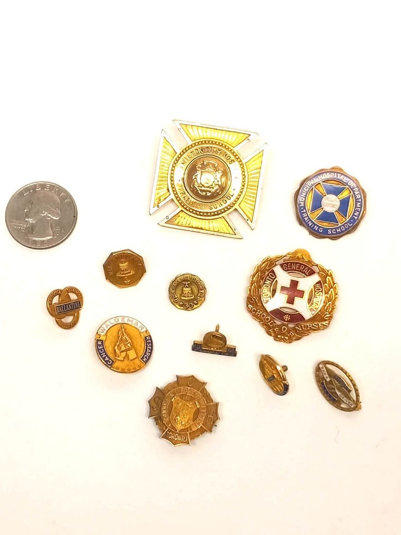 Group of 10k Gold Pins: Group of 11 gold pins all stamped 10k. Largest for Hamilton City Hospital Training School. All others either medical, service, or training related content. Total Weight: 25 dwt.