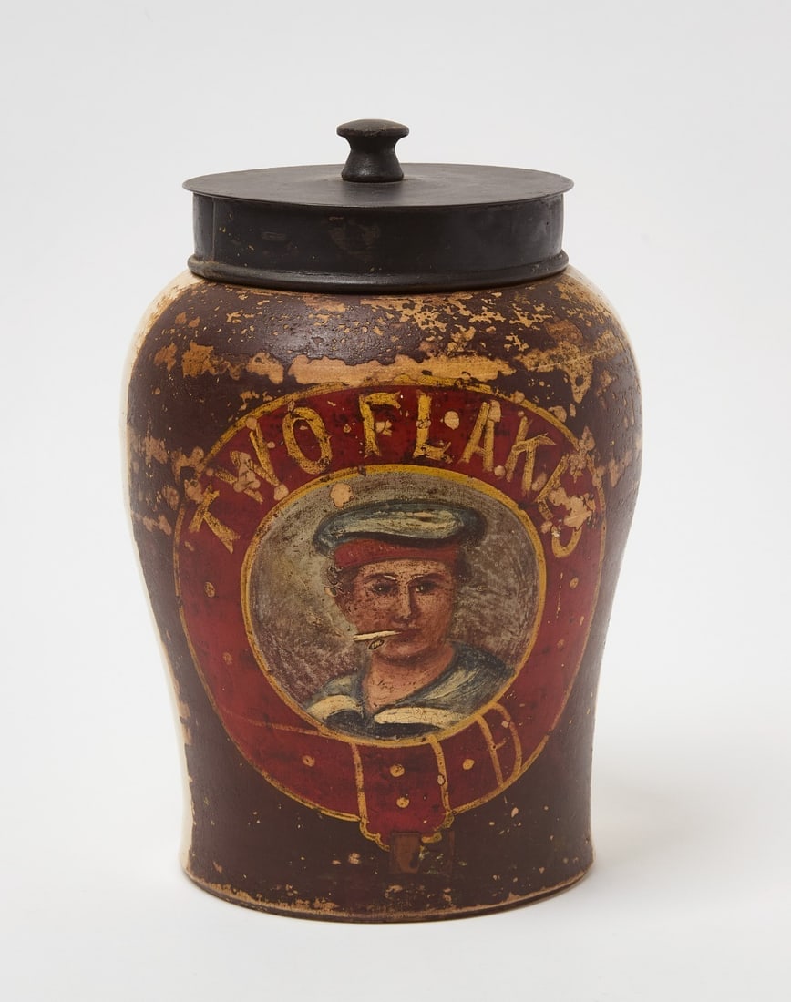 Two Flakes Tobacco Jar: 'Two Flakes' tobacco jar with sailor portrait. Salt-glazed stoneware with painted portrait. American, early 20th century. H 10-1/2 in.