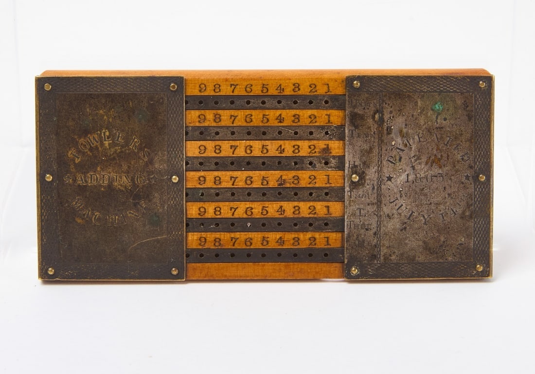 Fowler's Adding Machine - Pat. 1863: Fowler's Adding Machine. Patented July 14th, 1863. Wood and metal. H 2 in. W 4-1/2 in.