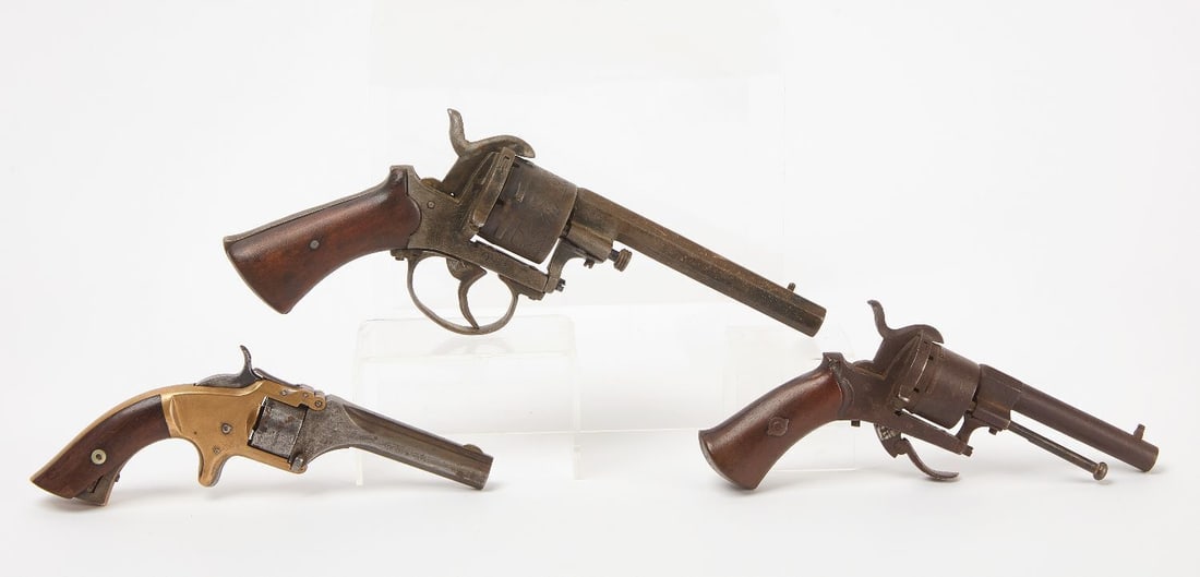 Three Revolvers: Three antique revolvers. Smith & Wesson No. 1 second issue .22 cal (ser. no. 22861). Two others with wood grips, likely European. 19th century.L 7-1/4 in.L 9-5/8 in. L 7-1/2 in. 