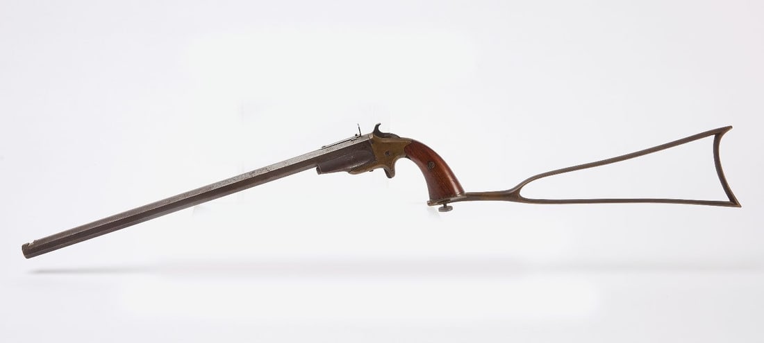 Frank Wesson Pocket Rifle: Frank Wesson Worcester, Massachusetts. Bicycle rifle Serial number 790 with detachable shoulder stock. The wood grips look to be original and show some wear. Some scattered pitting consistent with