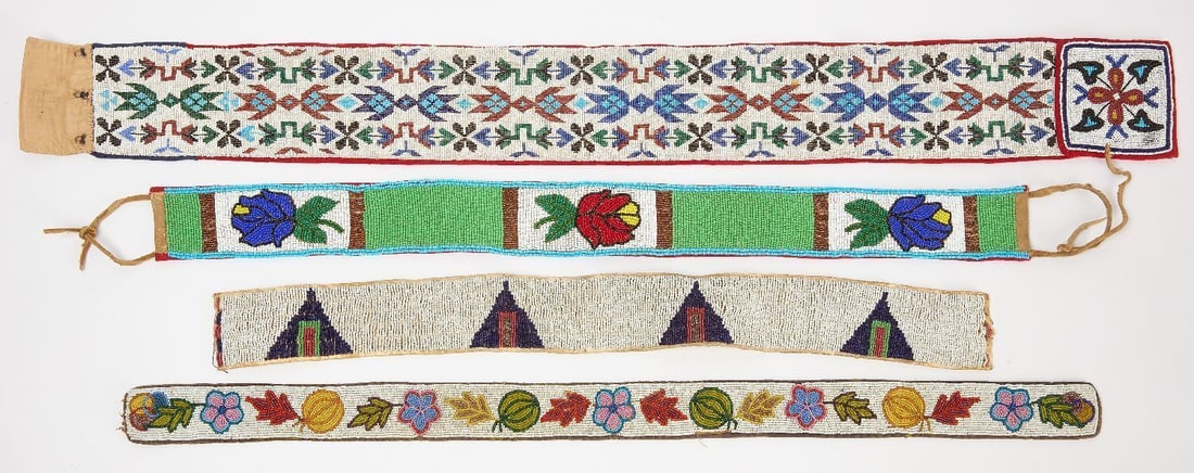 Four Native Beaded Belts: Three Native beaded belts.Loomed belt on fabric. All circa 1890-1925. L 39 in x 4 in.Floral belt on fabric with hide ends. L 30 in. x 2-3/4 in.Belt with fruit and flowers. Beadwork on hide. L 33 in.
