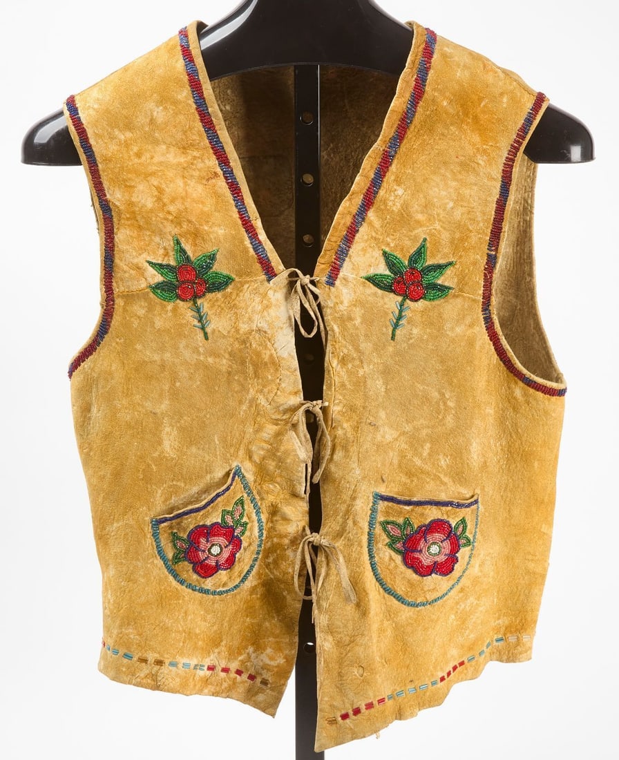 Native American Beaded Vest: Native American vest. Beadwork on hide. early 20th century.L 22 in. W 16-1/4 in.