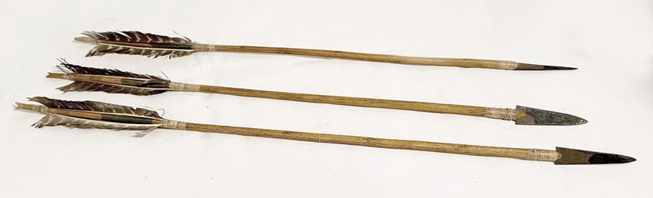 Three Native American Arrows: Three Native American arrows. Carved wood with pigment. Steel tips.Early to mid 20th century.L 28-1/4 in.
