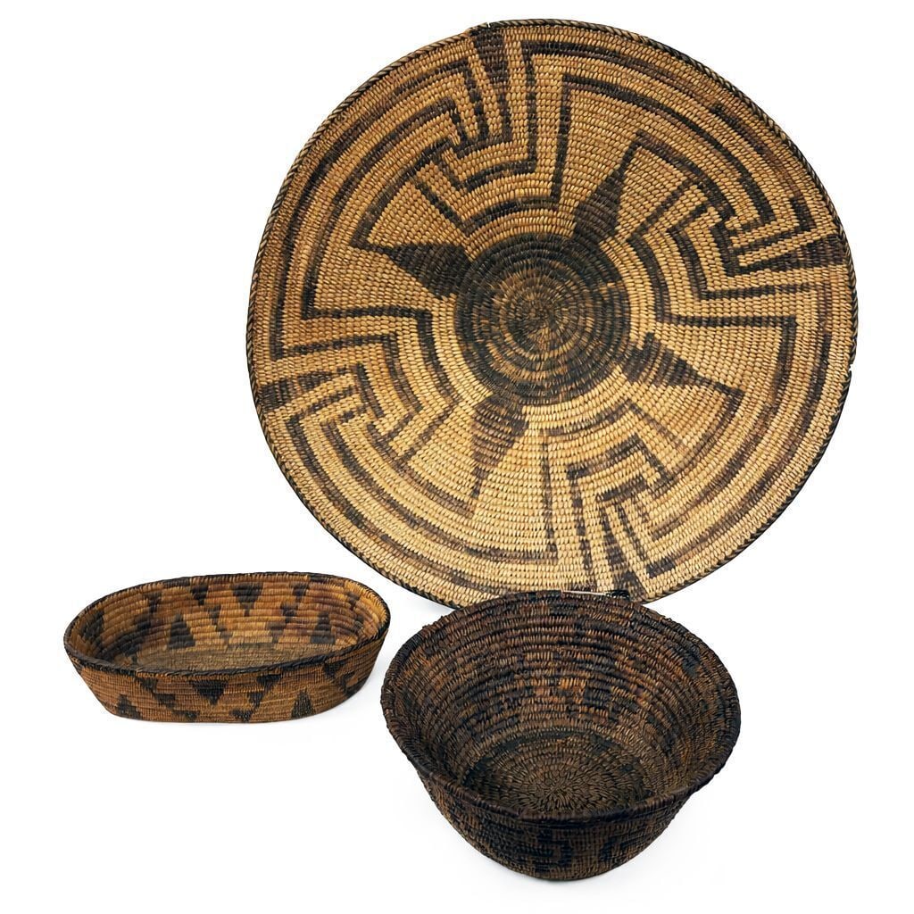 Three Native American Baskets: Three Native Ameircna baskets. A Pima shallow bowl, together with a small oval basket. and a small coiled basket. Late 19th century.Pima: D 15 in.Small oval basket: H 2 in. L 7-1/2 in. W 4-1/4