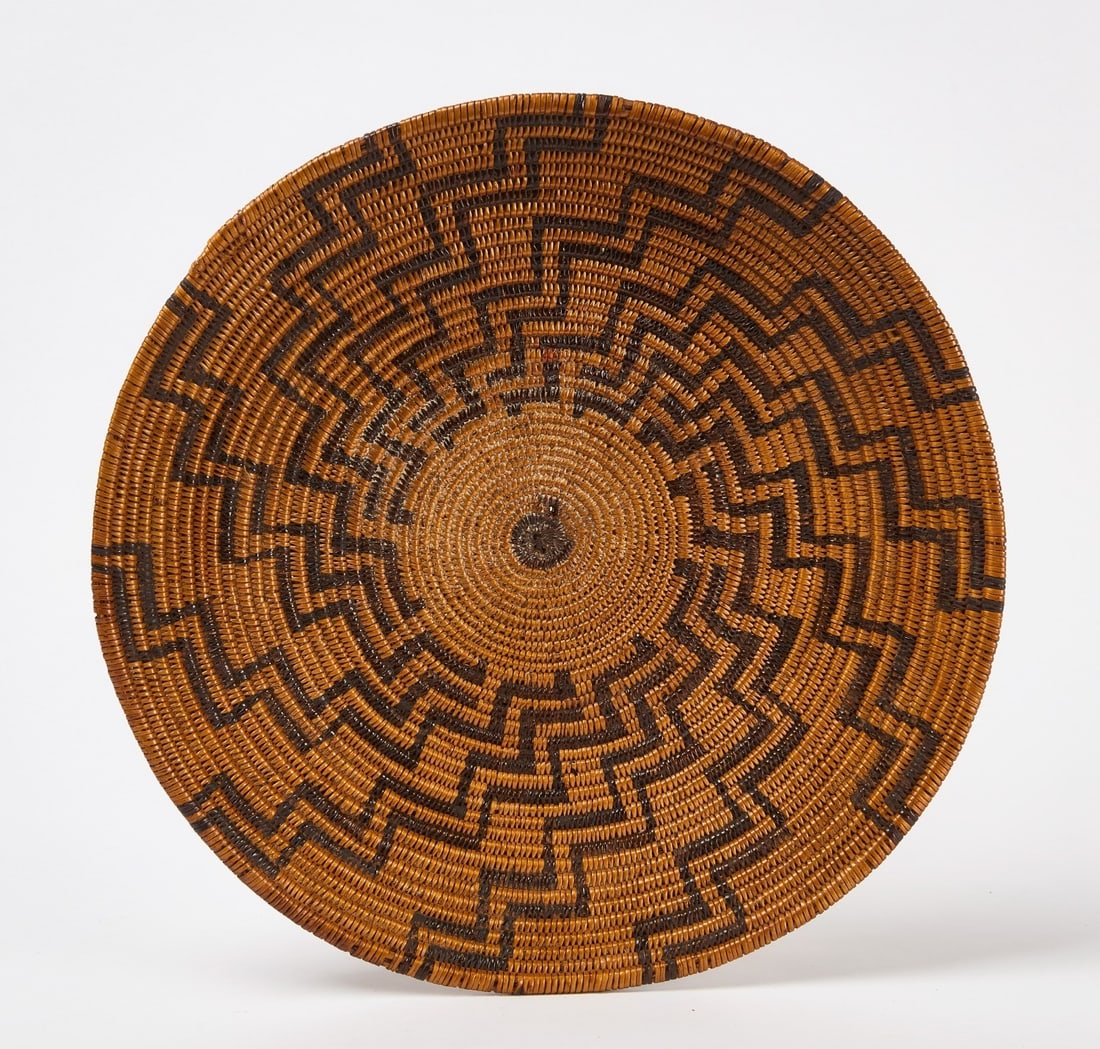 Apache Basket: Apache woven basket. Circa 1910.H 2-1/2 in. D 15 in.