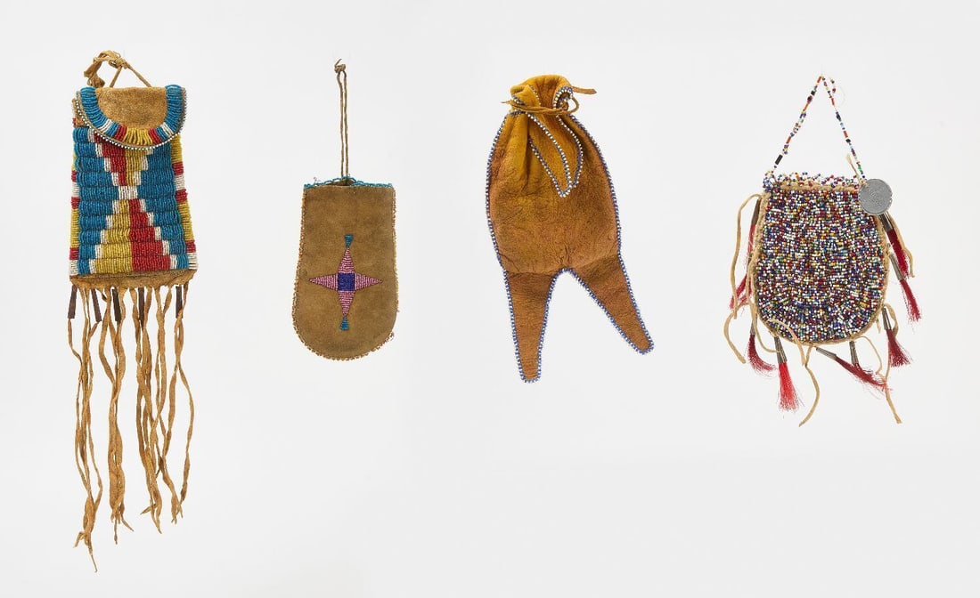 Four Small Beaded Bags: Four small Native beaded bads. Plains region, early 20th century.Yellow, white and blue, thread sewn: H with fringe, 14 in.Morning star, thread sewn: H 6-1/4 in.Blue and white edge beading, yellow