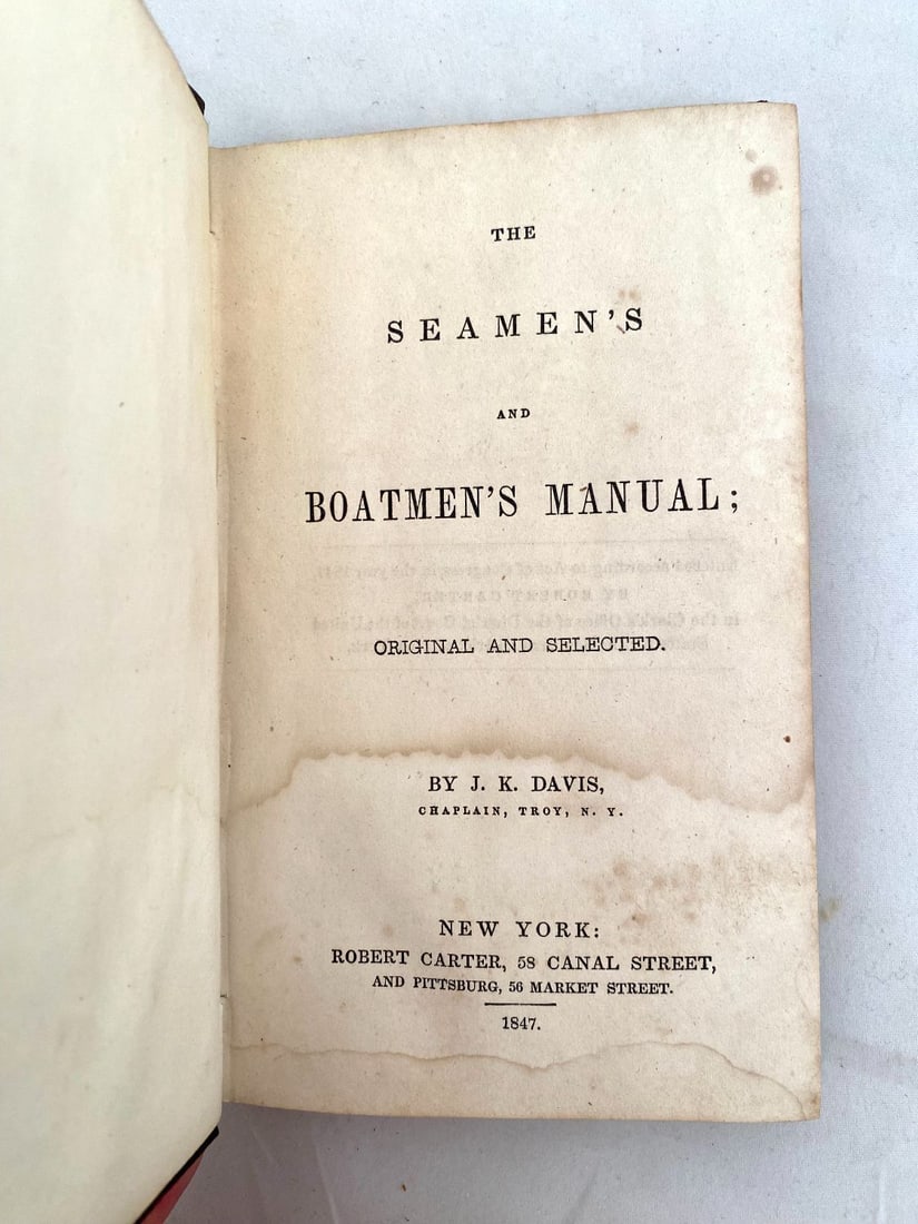 Three Antique Nautical Books: Seamanship and Devotional Literature: A group of three hardcover, antique nautical works capturing seamanship and devotional literature. Includes: (1) 'The Seaman's and Boatmen's Manual' by J.K. Davis, published by Robert