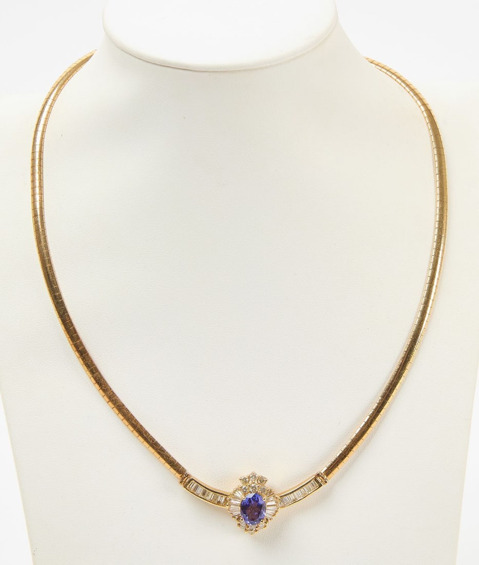 14k Necklace with Sapphire: 14k yellow gold (stamped) necklace with central sapphire and CZs. Italy. L (clasped): 7-3/4 in. Weight: 17.1 dwt.