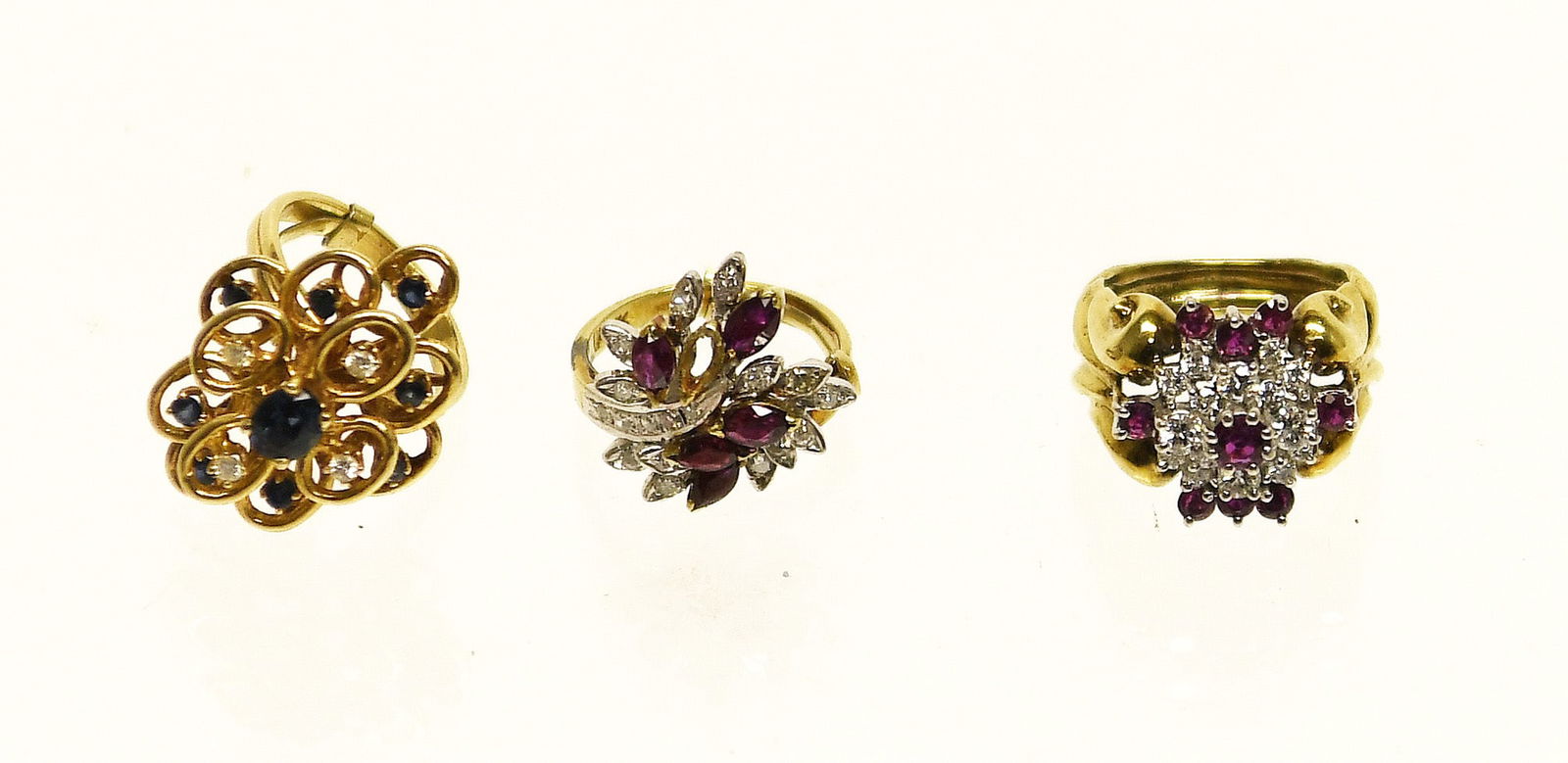 Three 14k Gold Rings with Diamonds and Emeralds: Three 14k gold rings with diamonds and emeralds. Total Weight: 12 dwt.Sizes 6, 7, and 7.