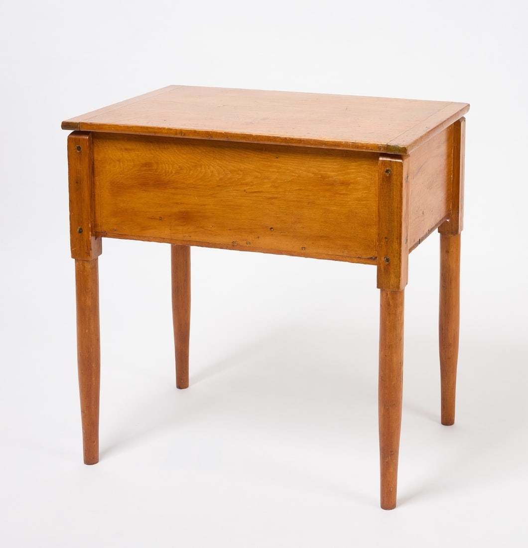 Shaker Lift-Top Work Table: Shaker lift-top work table. Pine. Hinged top with batten ends on blocks and turned legs. American, 19th century. H (with top closed) 28 in. W 27 in. D 18 in.H (with top open): 46