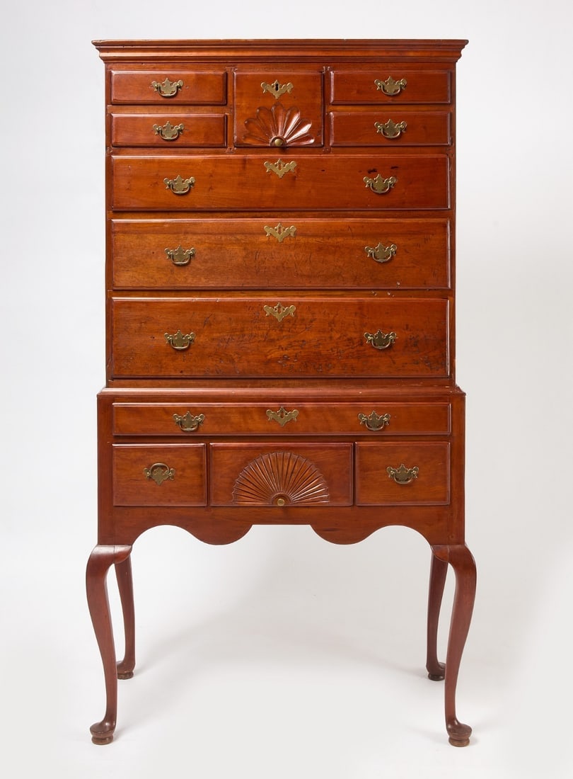 New England Highboy: Flat top highboy. Cabriole legs terminating in pad feet. Carved fans in upper and lower case. Cherry wood. New England, circa 1770.H 71 in. W Lower case: 37-1/8 in. W Upper case: 35-1/2 in.D Lower