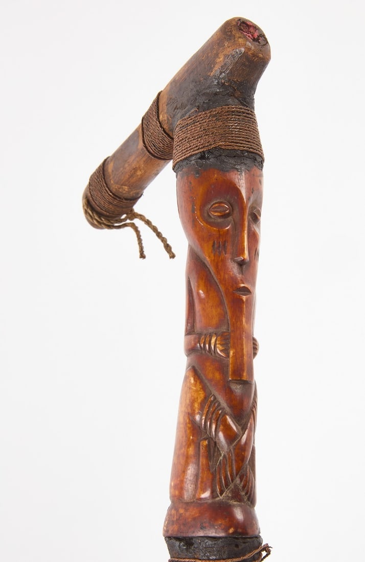 Tribal Carved Walking Stick: Antique African Tribal carved staff with carved horn figure. Several segments wrapped with twine. L 37-3/4 in.