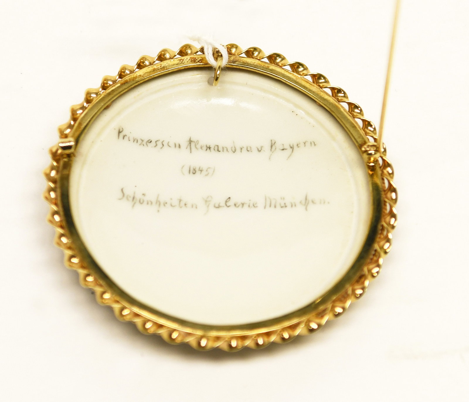 Portrait on Porcelain of Princess Alexandra Amelie of Bavaria: Portrait on porcelain of Princess Alexandra Amelie of Bavaria, after Joseph Karl Stieler's 1845 work. Mounted in a 14k gold setting. Signed 'A. Brauer 1985' D 2-7/8 in. Total Weight: 30 dwt.