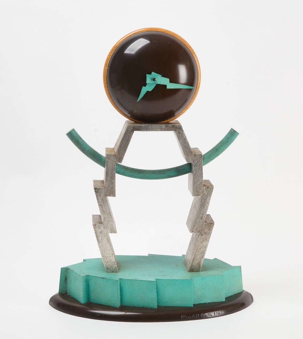 Wendell Castle Stair Step Table Clock: Wendell Castle - Stair Step Table Clock. Patinated copper, stained mahogany, curly maple, aluminum, and quartz movement21 h × 15.75 w × 9.25 d in (53 × 40 × 23 cm)Carved