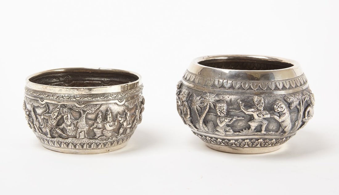 Two Burmese Repoussé Silver Bowls: Two Burmese repoussé silver bowls, the first with maker’s mark: Elephant on the underside, ca. late 19th century. An elaborate hunt scene including an elephant, camels with mounted