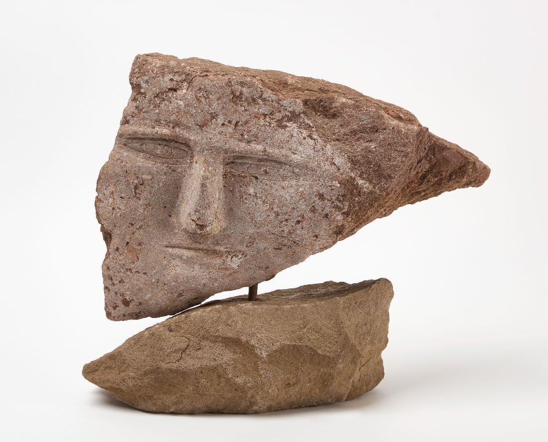 Ted Ludwiczak - Single Face on Pedestal: Ted Ludwiczak (American, born Poland,1926–2016) - Single face on pedestal. Carved stone on stone pedestal. H 15-1/4 in. W 17 in. Provenance: Purchased directly from the artist, 1997. "Ted