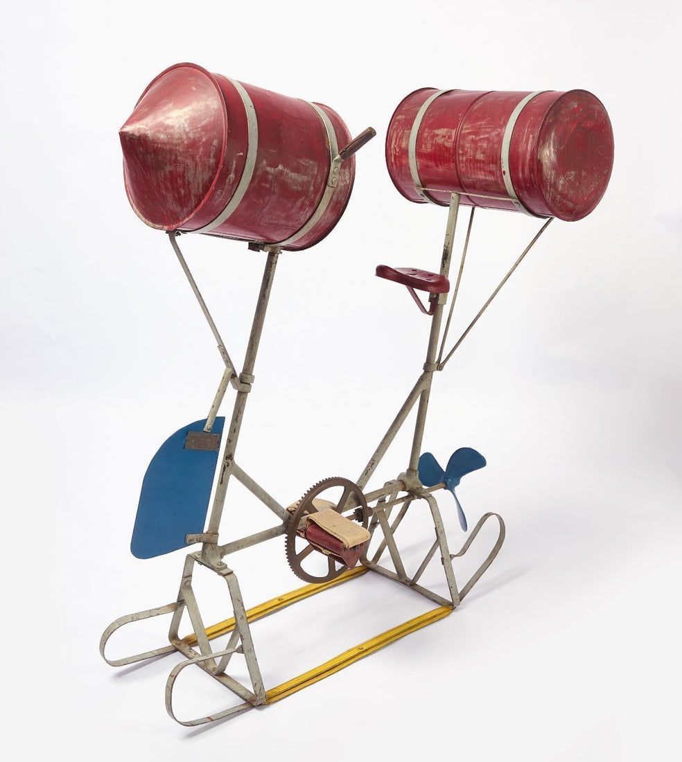 Eureka Floating Bicycle: Floating Bicycle by the Eureka Novelty Company, 1440 Broadway (NY). Welded steel frame supports a seat and two 12-in. diameter red painted airtight drums. Front with wooden steering handles and blue