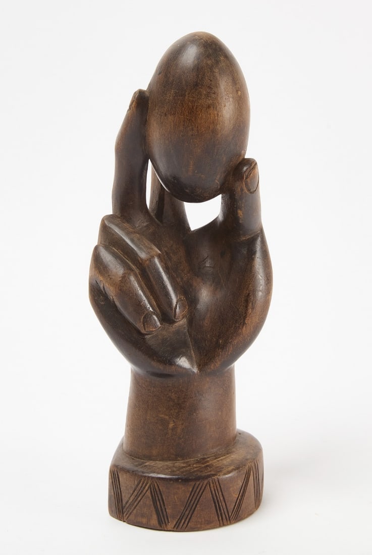 Folk Art Carving of a Hand holding an Egg: Folk art wood carving of a hand holding an egg. Circa 1930.H 12 in. W 5 in.