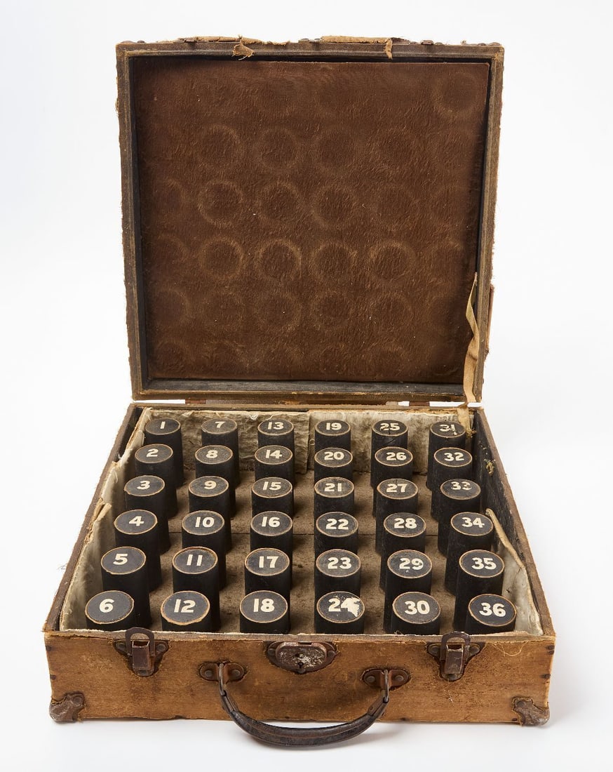 Cased Ring Toss Game: Ring toss game presented in a latched case. Cylinders inside numbered 1-36. American, circa 1930.(Closed) H 5-1/4 in. W 15 in. D 15-3/4 in.