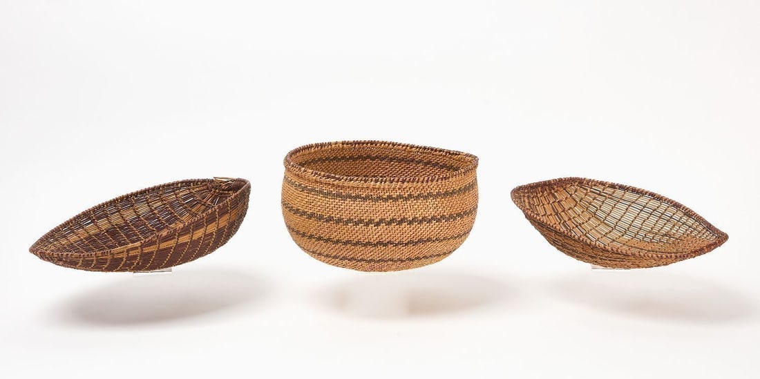 Three Northwest Coast Baskets: Three Northwest coast baskets. Two sifting baskets and a gathering basket.H 3-1/4 in. W 10 in. D 12-1/2 in. H 5-1/8 in. D 9-1/2 in. 