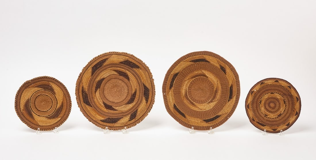 Four Hupa Basketry Trays: Four related Hupa Native basketry trays. Circa 1900. D 6-3/4 in. 6-3/4 in. 9-7/8 in 9-1/2 in.