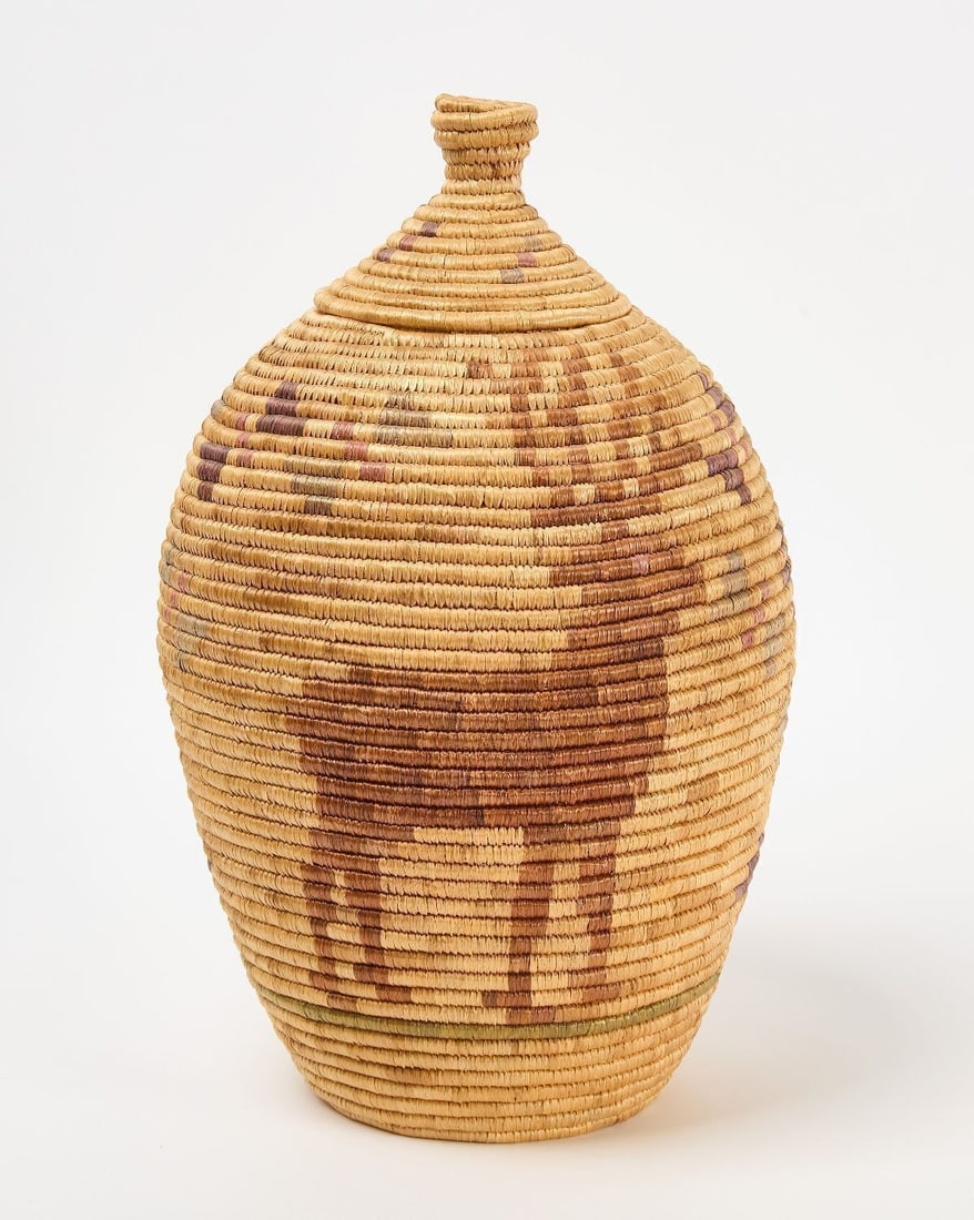 Yupik Coiled Storage Basket with Elk Design: Fine Yupik Coiled Storage Basket featuring elk designs. Circa 1940. H 19 in.
