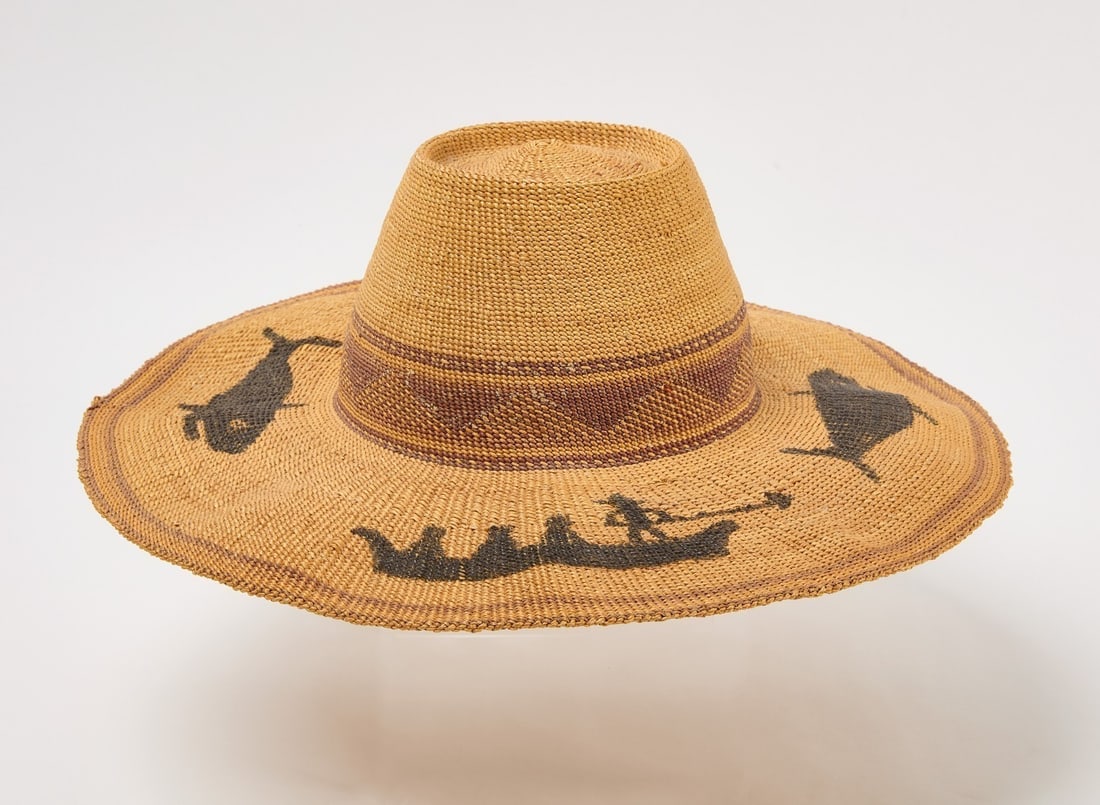 Makah Northwest Coast Whaler's Hat: Makah Northwest Whaler's hat with painted whale and boat motifs. Circa 1900. D 16 in. Head opening: 6-3/4 in x 7 in.