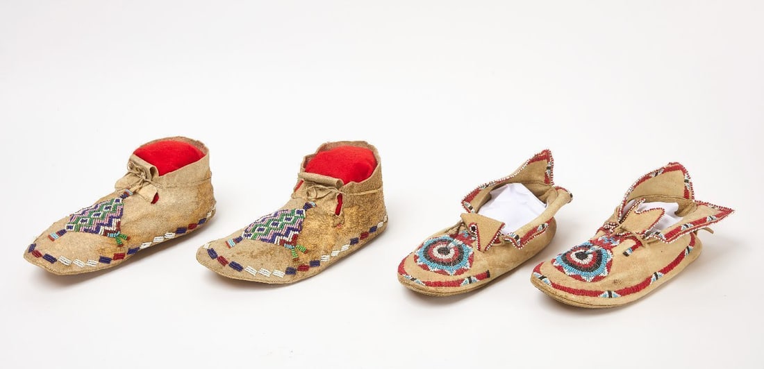 Two Pairs of Beaded Moccasins: Two pairs of Native moccasins. Beadwork on hide. Plains region, circa 1910.L 10 in and 10-1/2 in.