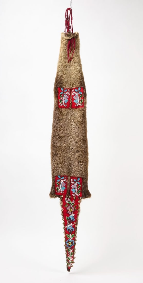 Native American Beaded Pelt Medicine Bag: Native America beaded otter pelt medicine bag with floral motifs. Cree/Chippewa/Menominee, Great Lakes, circa 1900.L 52 in. W 9 in.