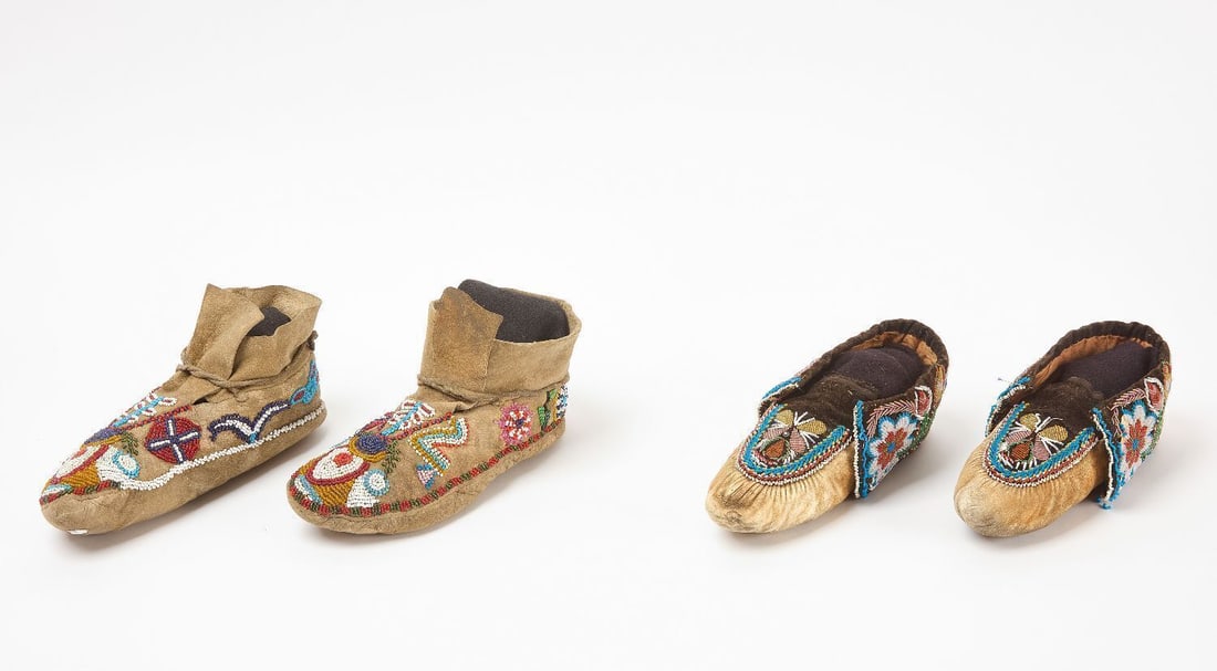 Two Pairs of Beaded Moccasins: Two pairs of Native moccasins. Glass beads on fabric and hide. Great Lakes region, circa 1900.L 8-1/2 in.