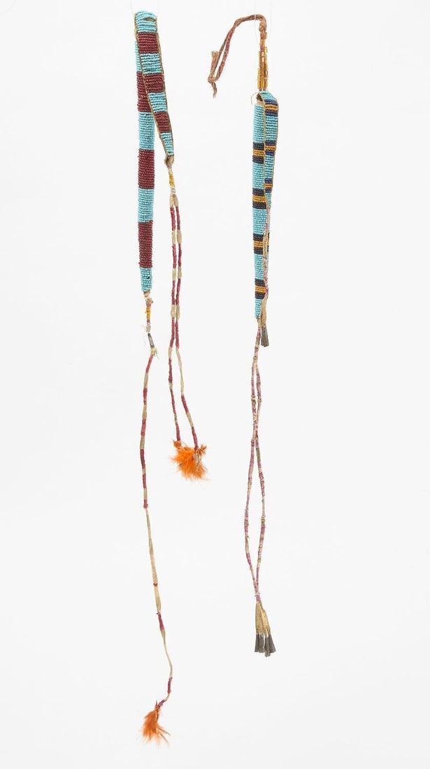 Two Sioux Awl Cases: Two Sioux awl cases. Beadwork on hide with quillwork drops. Circa 1900. L 18 in. Case: L 7 in. / L 23 in. Case: L 9 in.