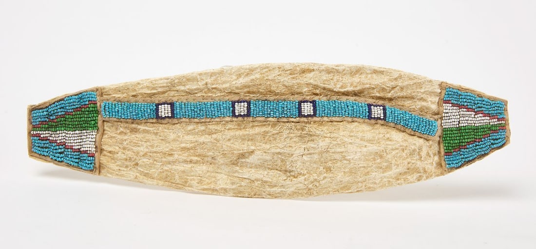 Cheyenne Snake Skin Quill Carrier: Snake skin bladder pouch used as a quill carrier, with applied hide and beadwork. Sinew sewn. Cheyenne, circa 1900. L. 11 in.