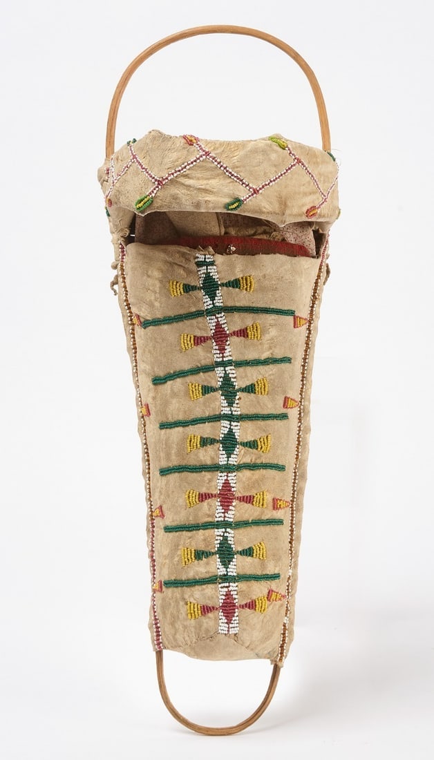 Apache Doll and Cradle: Apache cradle and doll. Beadwork on hide. Circa 1920. L 20 in. 