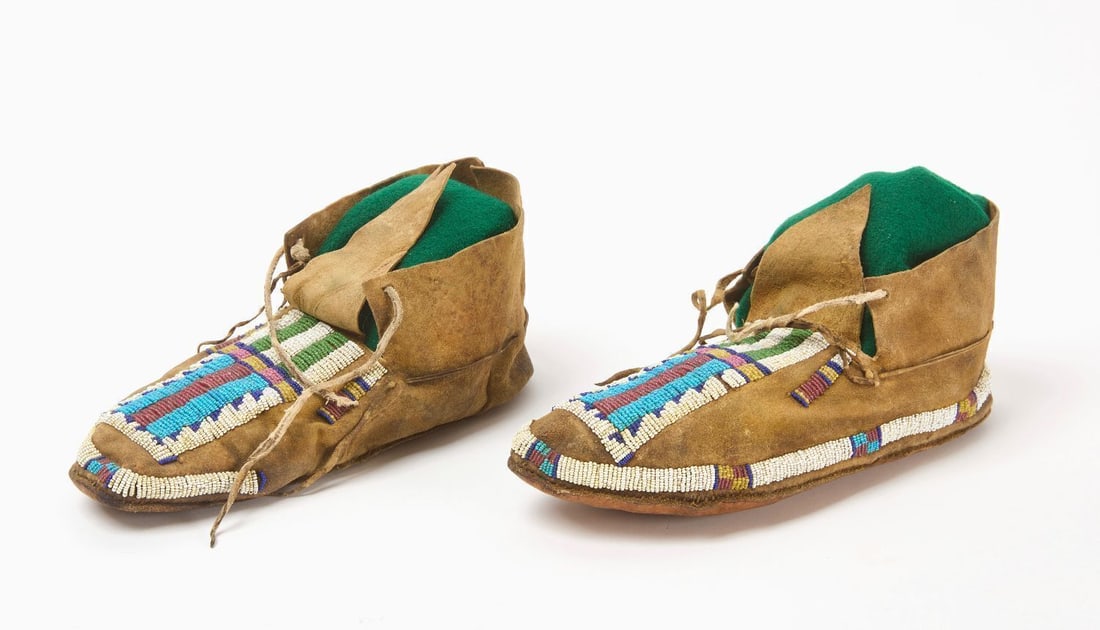 Pair of Native American Crow Moccasins: Pair of Crow moccasins. Beadwork on hide. Circa 1920.L 9 in.