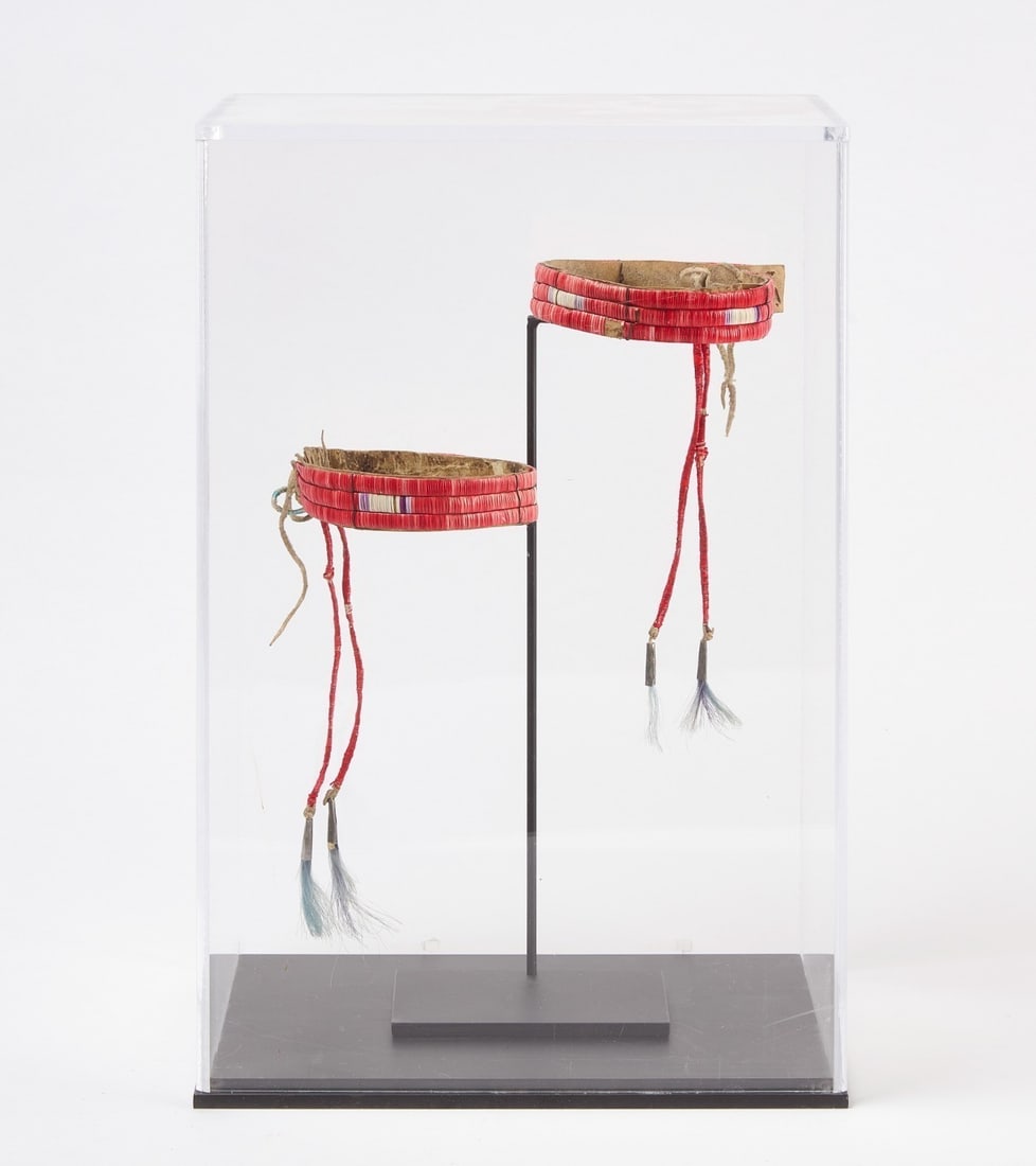 Pair of Quillwork Arm Bands: Pair of quill work arm bands. Quillwork on hide. Circa 1900.L 8 in. D 4-1/4 in.