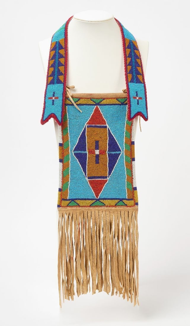 Crow Mirror Bag: Crow mirror bag. Beadwork on cloth lined hide. Sinew sewn. Early 20th century.L 24 in.