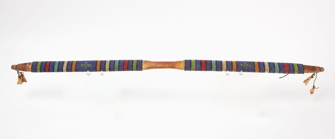 Native Beaded Bow with Elk Bone Fetish: Native America beaded with elk bone fetish on each end and two cross designs. Late 19th century to early 20th century. L 46-1/2 in.