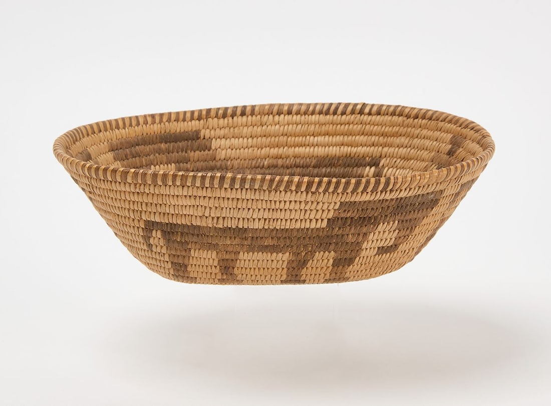 Pima Oval Basket with Figures: Pima oval coiled basket with elephants and human figures. Circa 1900. H 2-5/8 in. W 8-1/2 in. D 6-1/4 in.