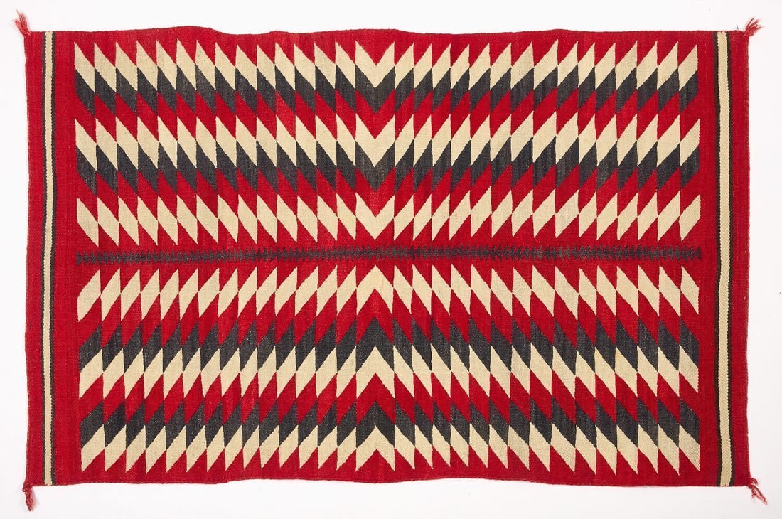 Navajo Rug: Handwoven Navajo rug with geometric diamond patterns, early 20th century.L 66-1/2 in. W 41-3/4 in.