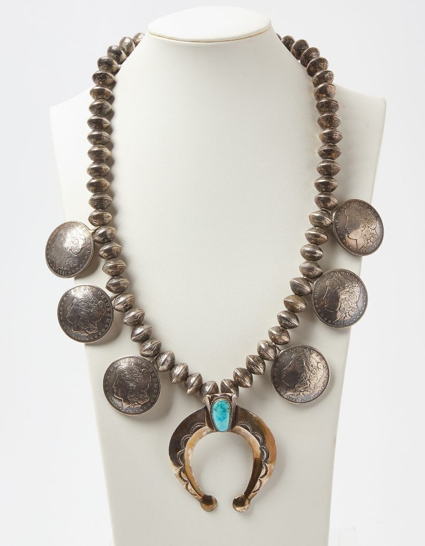 Native American Squash Blossom with US Peace Dollars: Native American squash blossom necklace with US silver peace dollars. circa 1930.Overall: L 15-1/4 in.Naja: 3 in.Total Weight: 15.18 ozt.