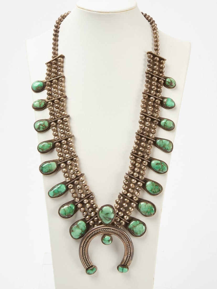 Native American Triple Strand Squash Blossom with Turquoise: Native American triple strand squash blossom necklace with green turquoise stones. circa 1930. Overall: L 16-1/2 in. Naja: L 2-1/2 in. Total Weight: 9.19 ozt.