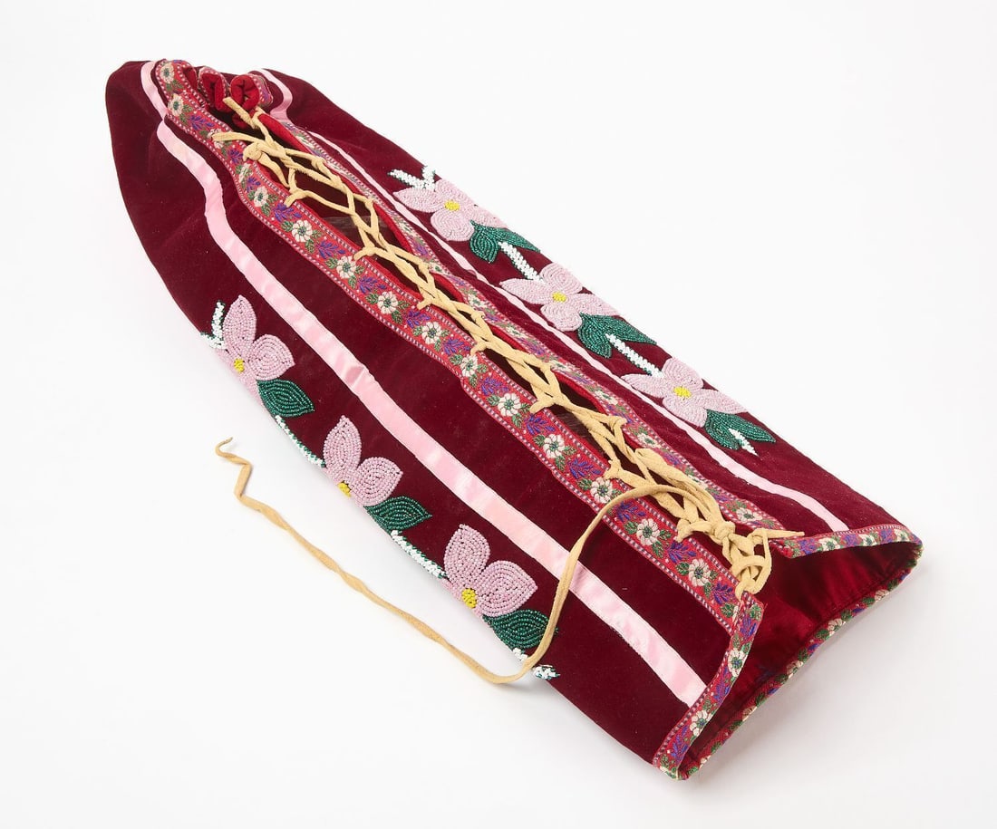 Native American Cradle Cover: Native American woodlands Indian cradle cover with floral designs and satin ribbon accents, late 19th-early 20th century. L24 in. W 12 in. 